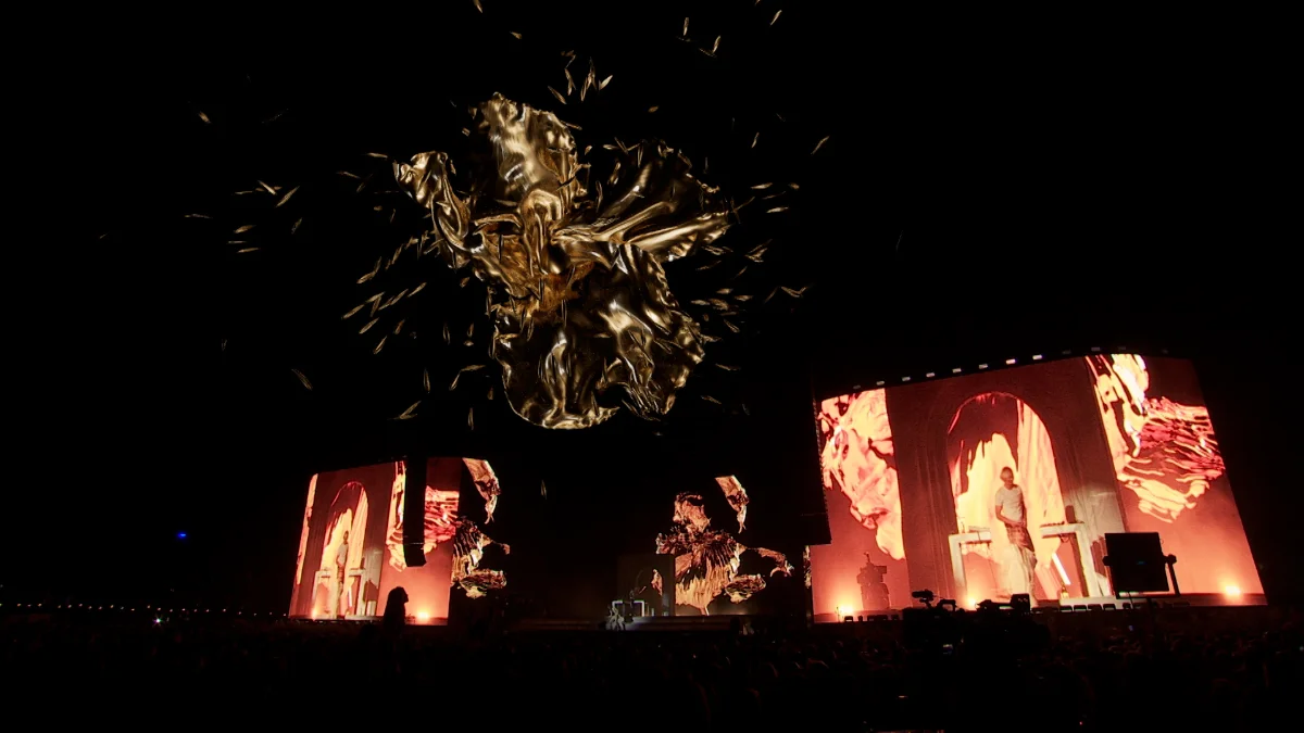 Stage rig from the floor, crowd silhouetted