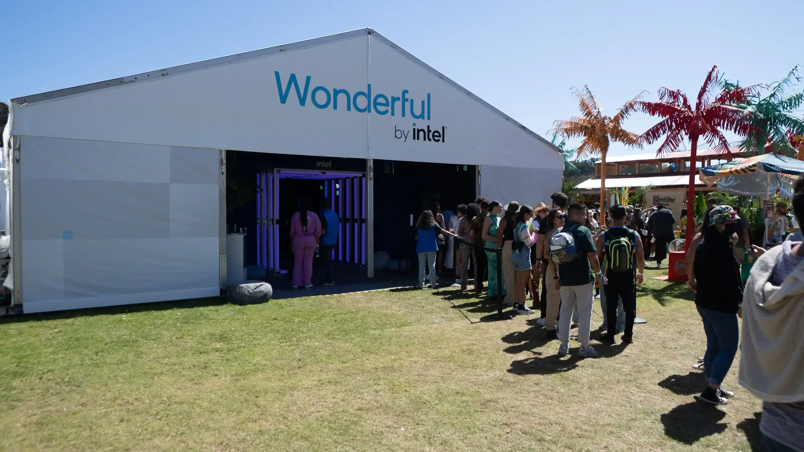 A group of people are standing in line to enter a building.